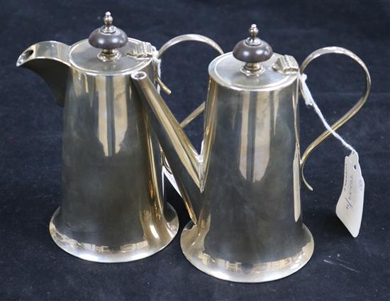 A silver cafe au lait set, of plain tapered cylindrical form with turned wood finials, Sheffield 1923, Walker & Hall, 19.7oz
